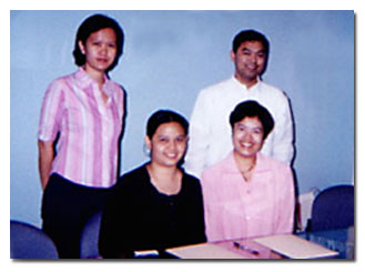Present during the contract signing are (seated from left) Ms. Joyce See, and Ms. Clarissa Cruz; (standing) Ms. Mathel Ong, and Mr. Joyj Azurin.